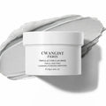 Jar of clay detox face mask on a dark background with label visible